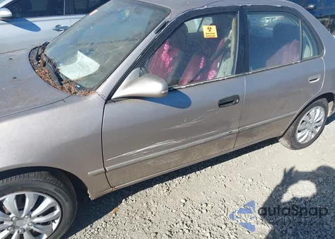 1999 Toyota Corolla Le z USA, uszkodzony, nr VIN 2T1BR12E6XC161465